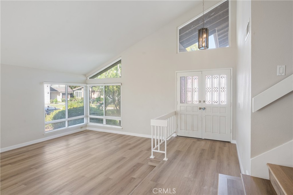 2 Glorieta East Irvine, CA 92620 - Photo 11 of 23 an empty room with wooden floor and windows