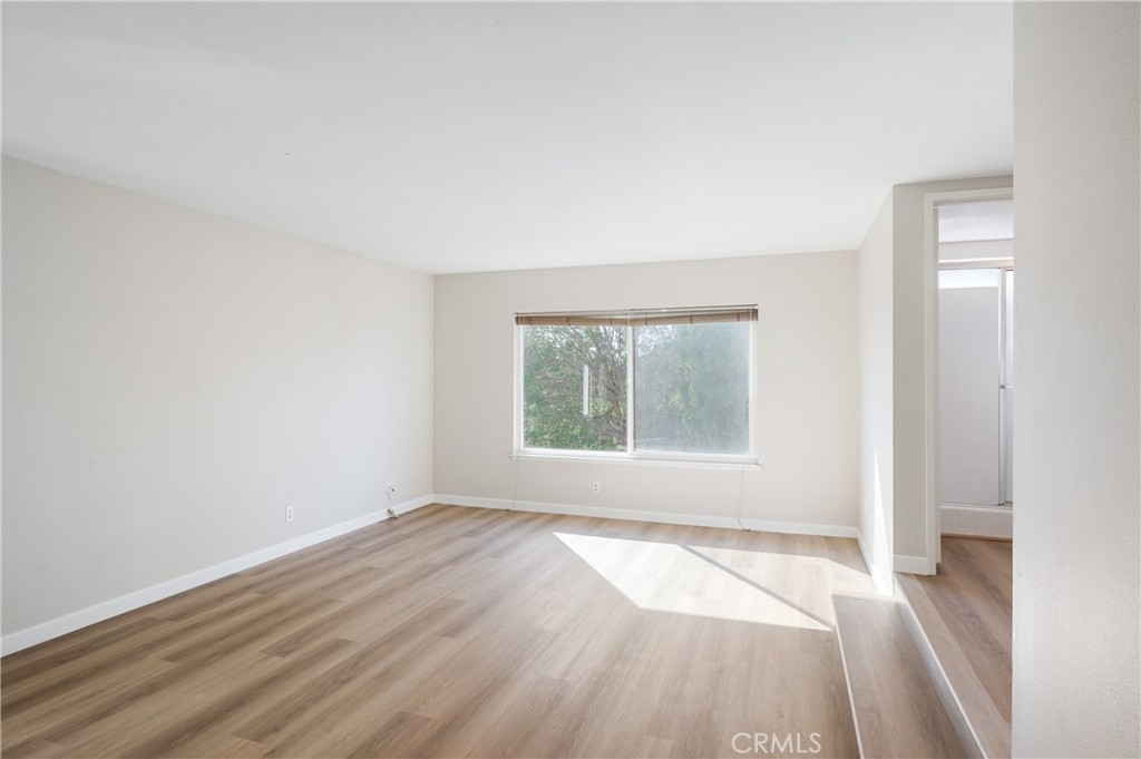 2 Glorieta East Irvine, CA 92620 - Photo 12 of 23 an empty room with wooden floor and windows