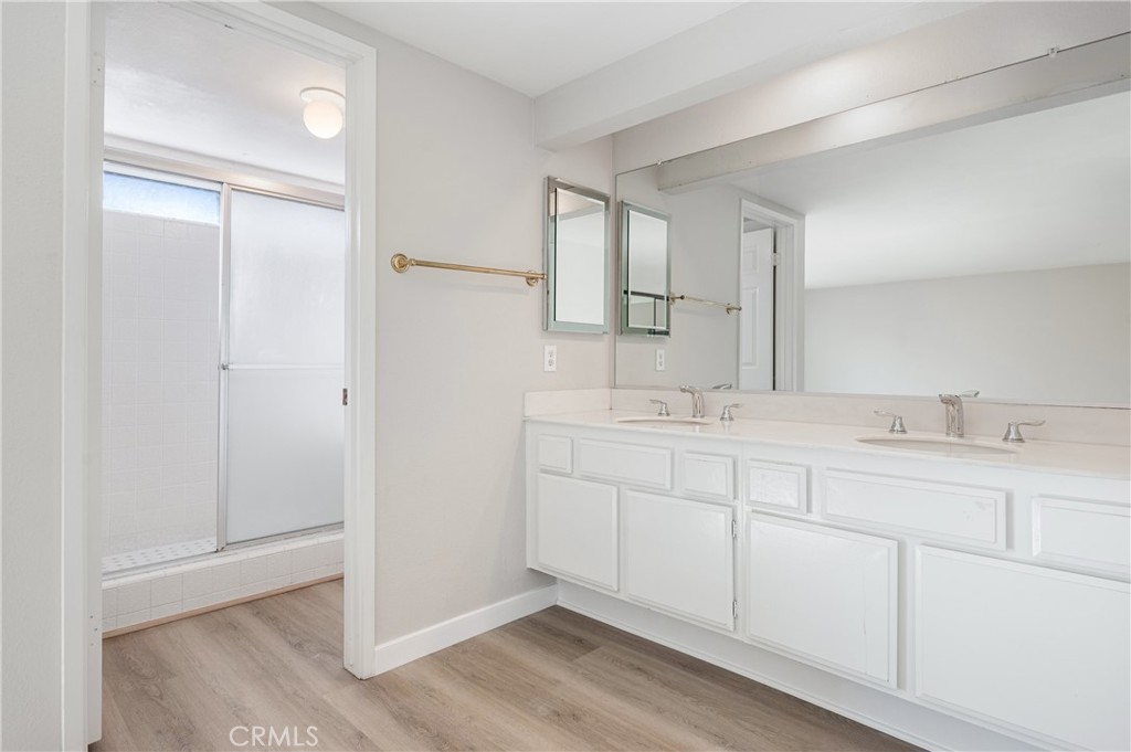 2 Glorieta East Irvine, CA 92620 - Photo 13 of 23 a bathroom with a double vanity sink and a mirror