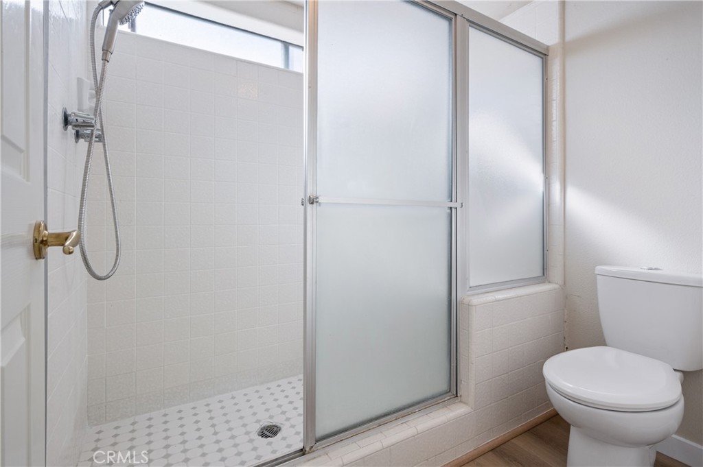 2 Glorieta East Irvine, CA 92620 - Photo 14 of 23 a bathroom with a shower and toilet
