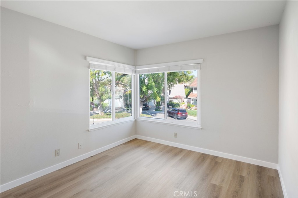 2 Glorieta East Irvine, CA 92620 - Photo 16 of 23 an empty room with wooden floor and window