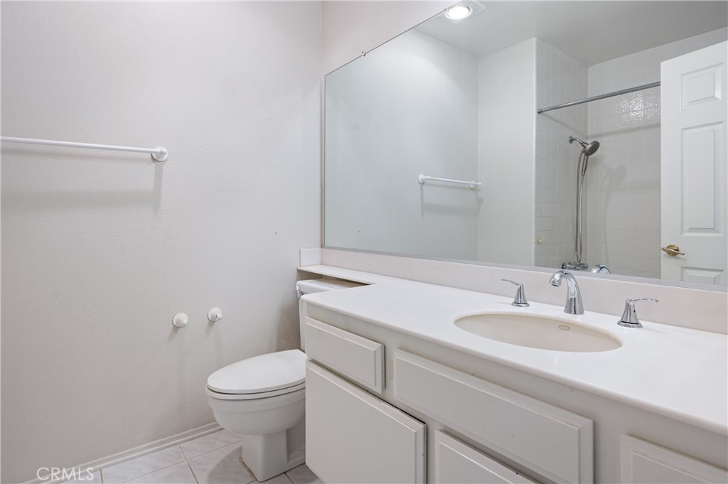 2 Glorieta East Irvine, CA 92620 - Photo 17 of 23 a bathroom with a sink toilet vanity and shower