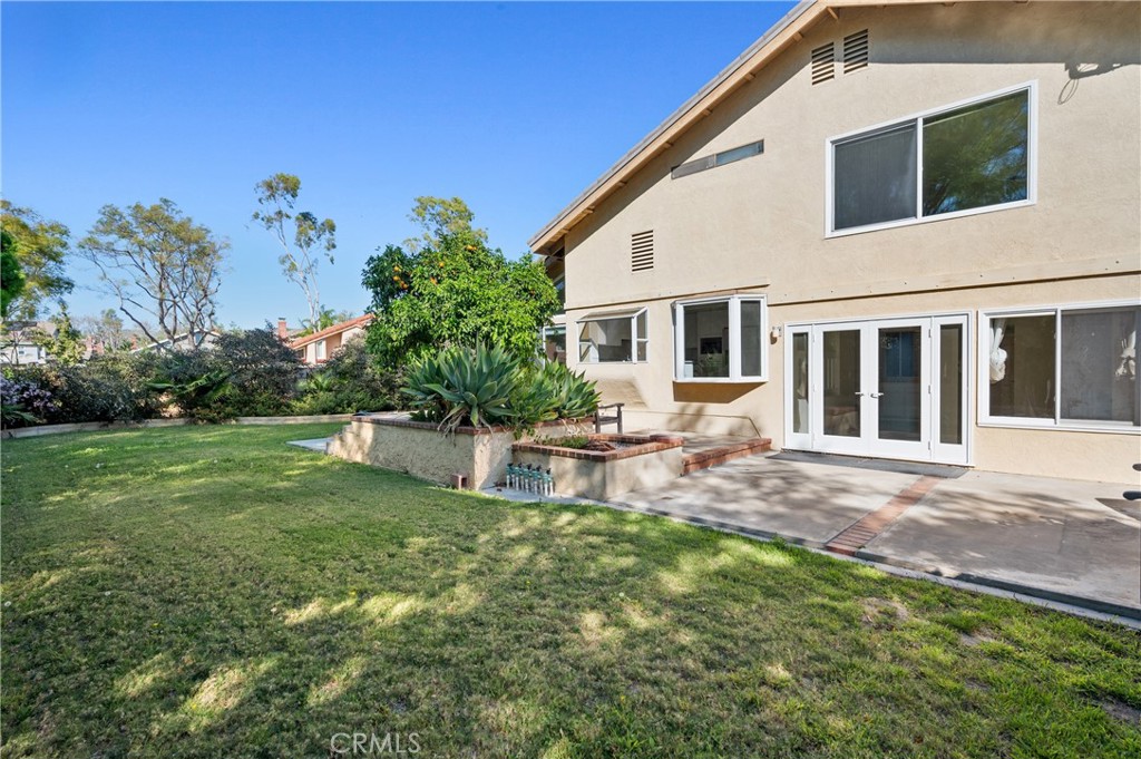 2 Glorieta East Irvine, CA 92620 - Photo 22 of 23 a view of a house with a backyard