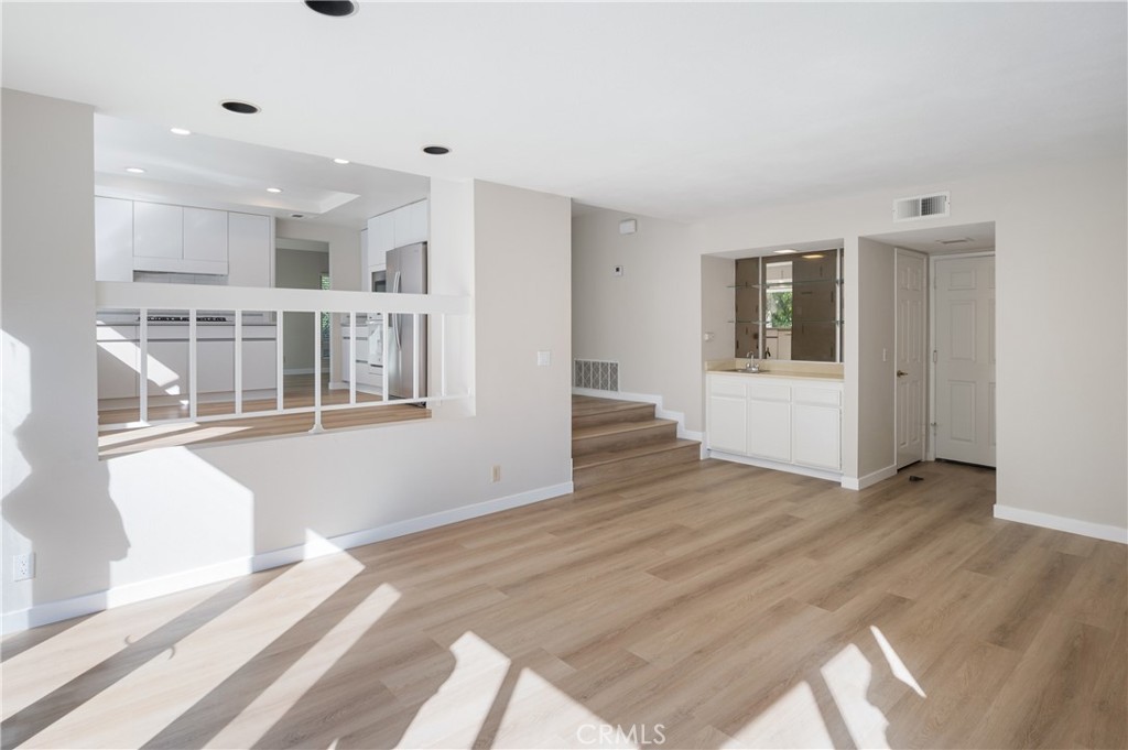 2 Glorieta East Irvine, CA 92620 - Photo 9 of 23 a view of an empty room with wooden floor and a window
