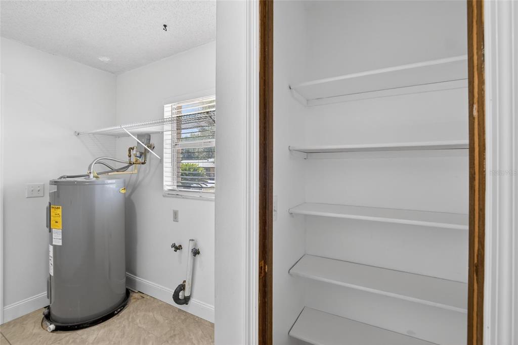 2340 Merrily Circle South Seffner, FL 33584 - Photo 28 of 52 a view of walk in closet with empty racks