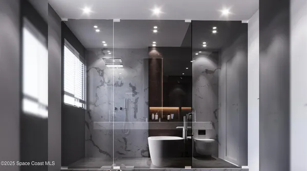 a bathroom with a glass shower door