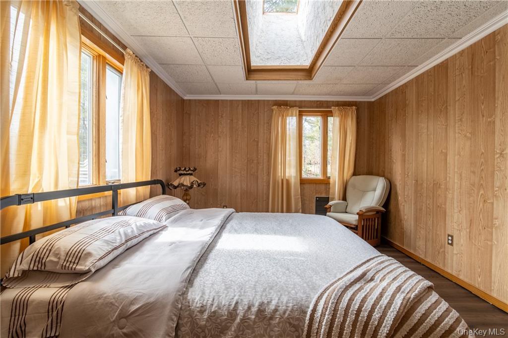 71 Kawlija Road Grahamsville, NY 12740 - Photo 11 of 16 a bedroom with a bed and chair