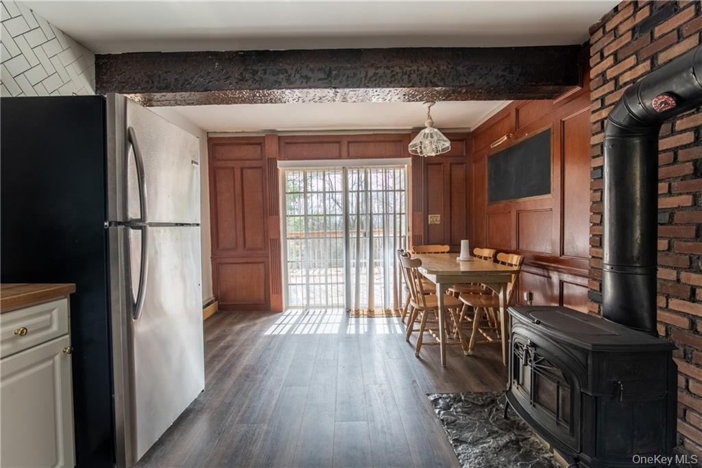 71 Kawlija Road Grahamsville, NY 12740 - Photo 8 of 16 a kitchen with kitchen island a counter top space a sink a refrigerator and a cabinets