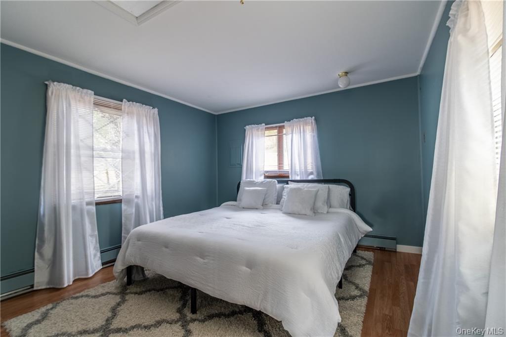 71 Kawlija Road Grahamsville, NY 12740 - Photo 9 of 16 a bedroom with a bed and a window