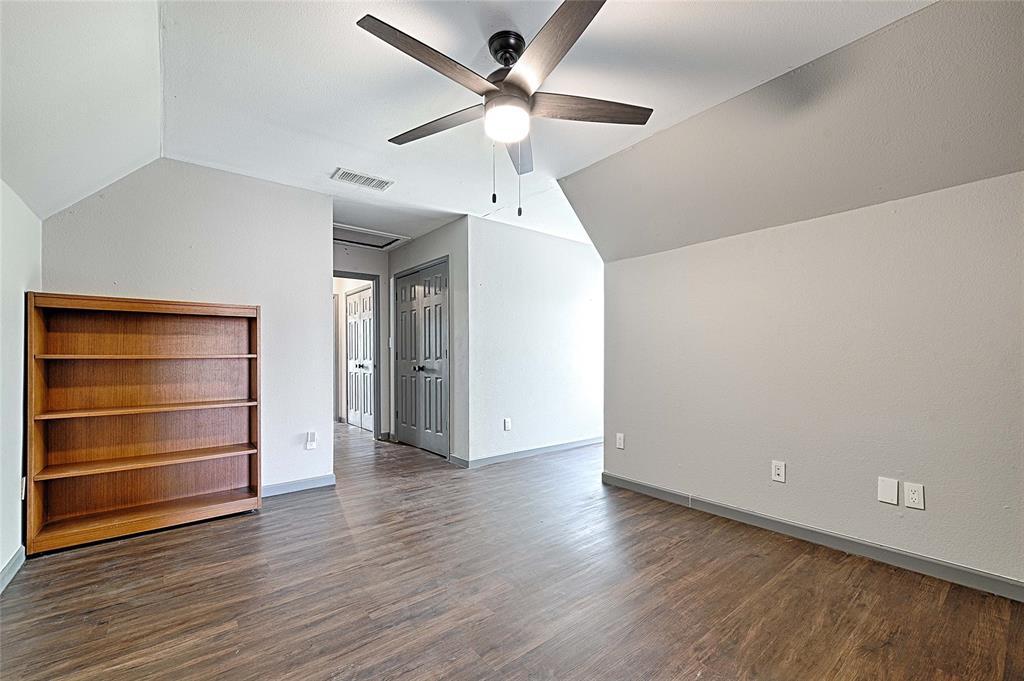 4805 Hunters Ridge Drive Sachse, TX 75048 - Photo 13 of 24 a view of room with wooden floor and ceiling fan