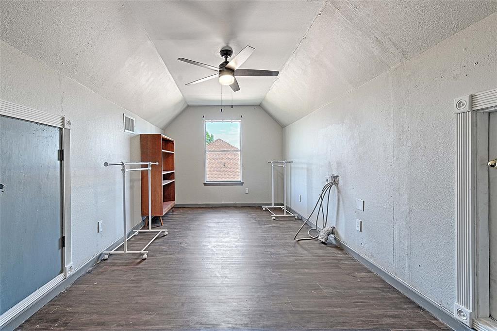 4805 Hunters Ridge Drive Sachse, TX 75048 - Photo 14 of 24 wooden floor in an empty room with a window