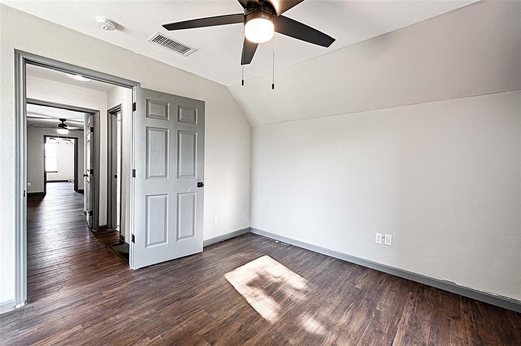 4805 Hunters Ridge Drive Sachse, TX 75048 - Photo 17 of 24 wooden floor in an empty room with a window