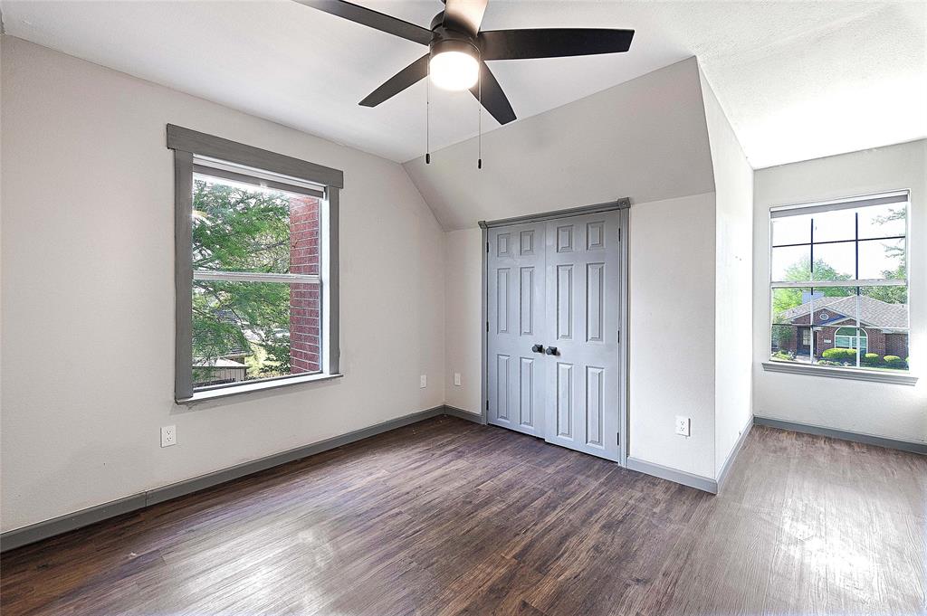 4805 Hunters Ridge Drive Sachse, TX 75048 - Photo 18 of 24 a view of an empty room with wooden floor and a window