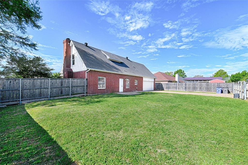 4805 Hunters Ridge Drive Sachse, TX 75048 - Photo 22 of 24 a view of a house with a yard