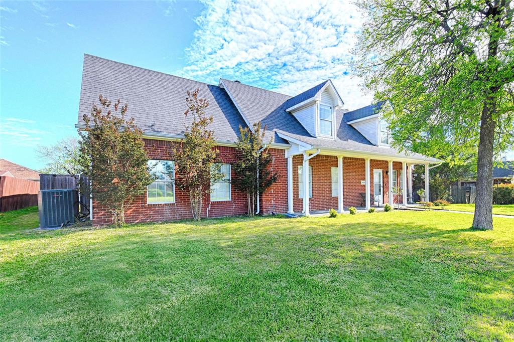 4805 Hunters Ridge Drive Sachse, TX 75048 - Photo 23 of 24 a view of a house with a yard and large trees