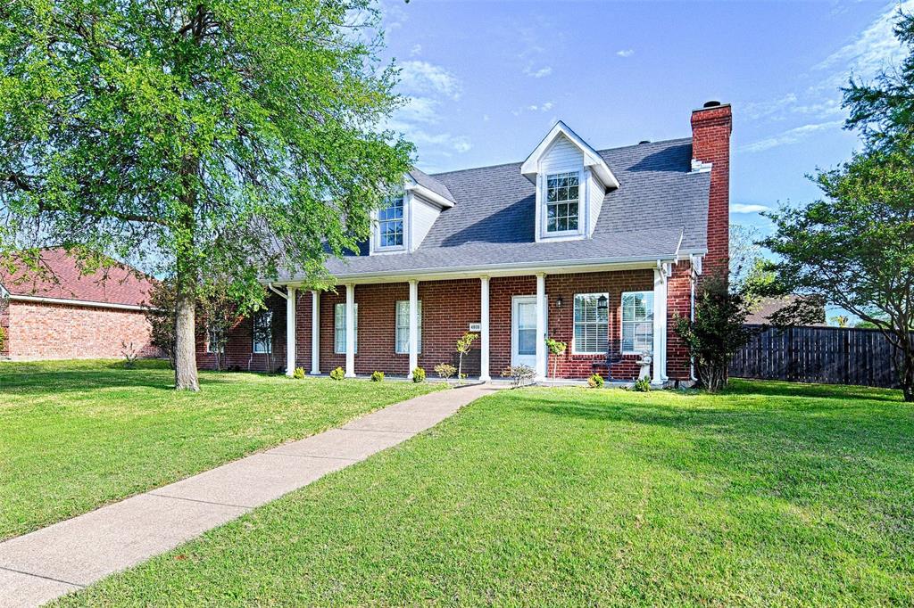 4805 Hunters Ridge Drive Sachse, TX 75048 - Photo 24 of 24 a front view of a house with a yard