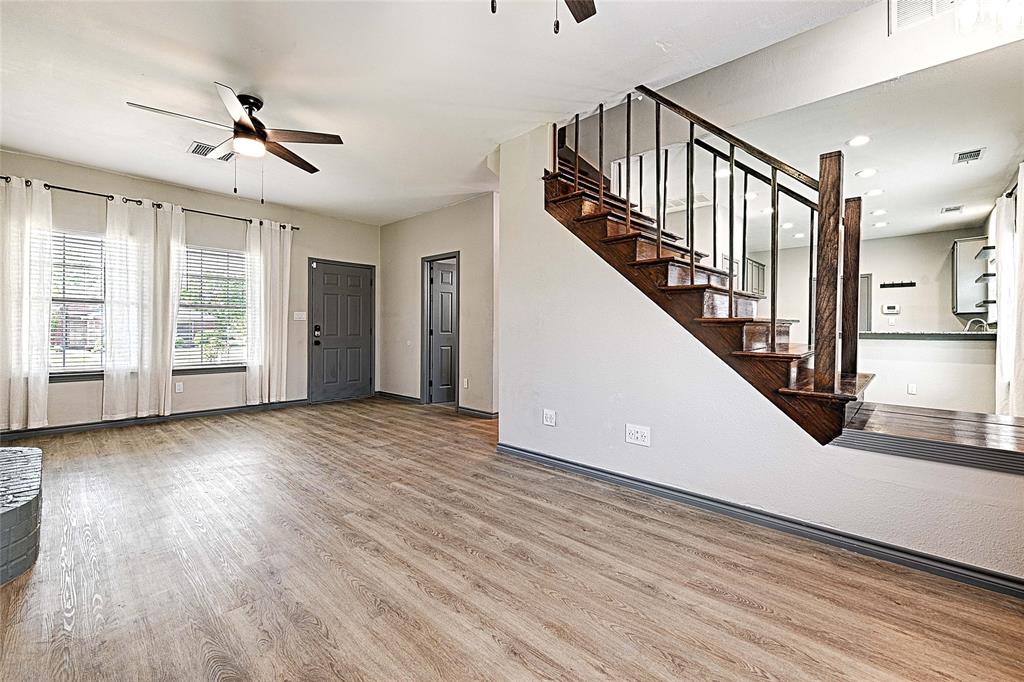 4805 Hunters Ridge Drive Sachse, TX 75048 - Photo 4 of 24 a view of an entryway with wooden floor