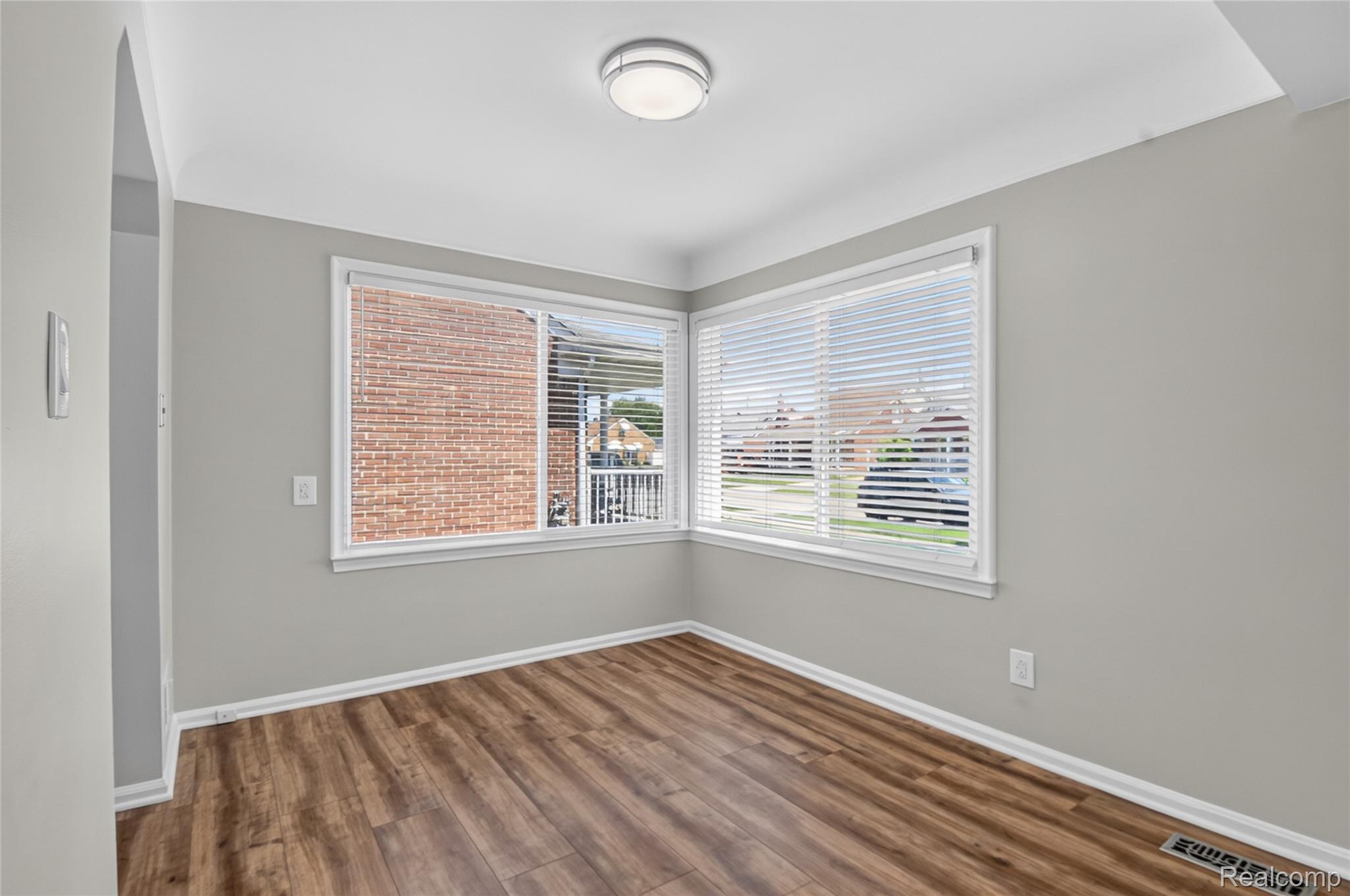 12972 Callender Street Southgate, MI 48195 - Photo 13 of 40 Bright room featuring wood-finish flooring and light gray painted walls