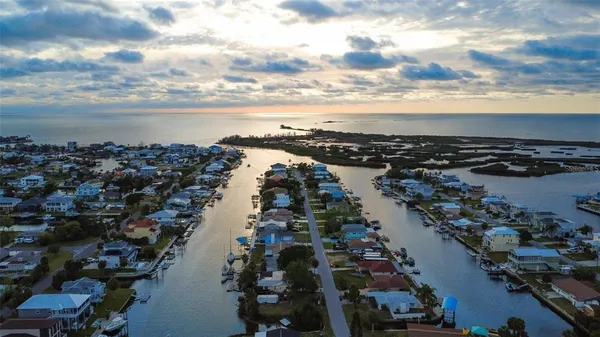 an aerial view of city and lake