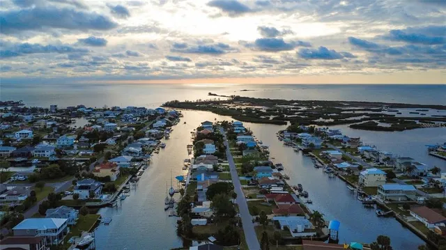 an aerial view of city and lake