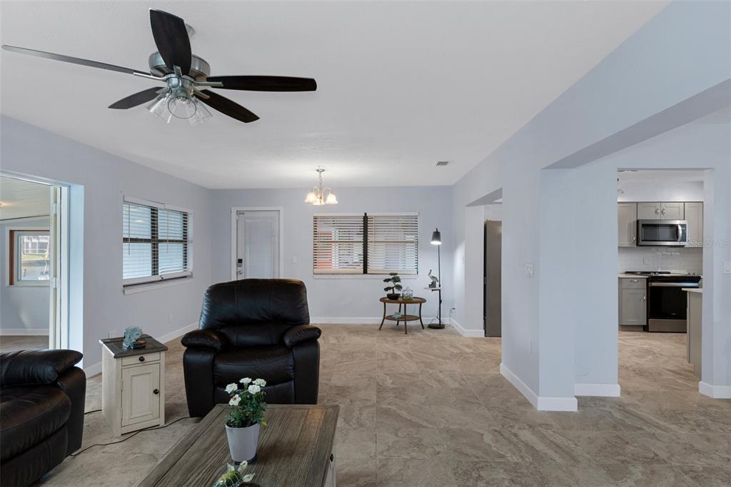 4964 Cedarbrook Lane Hernando Beach, FL 34607 - Photo 14 of 29 a living room with furniture and a window