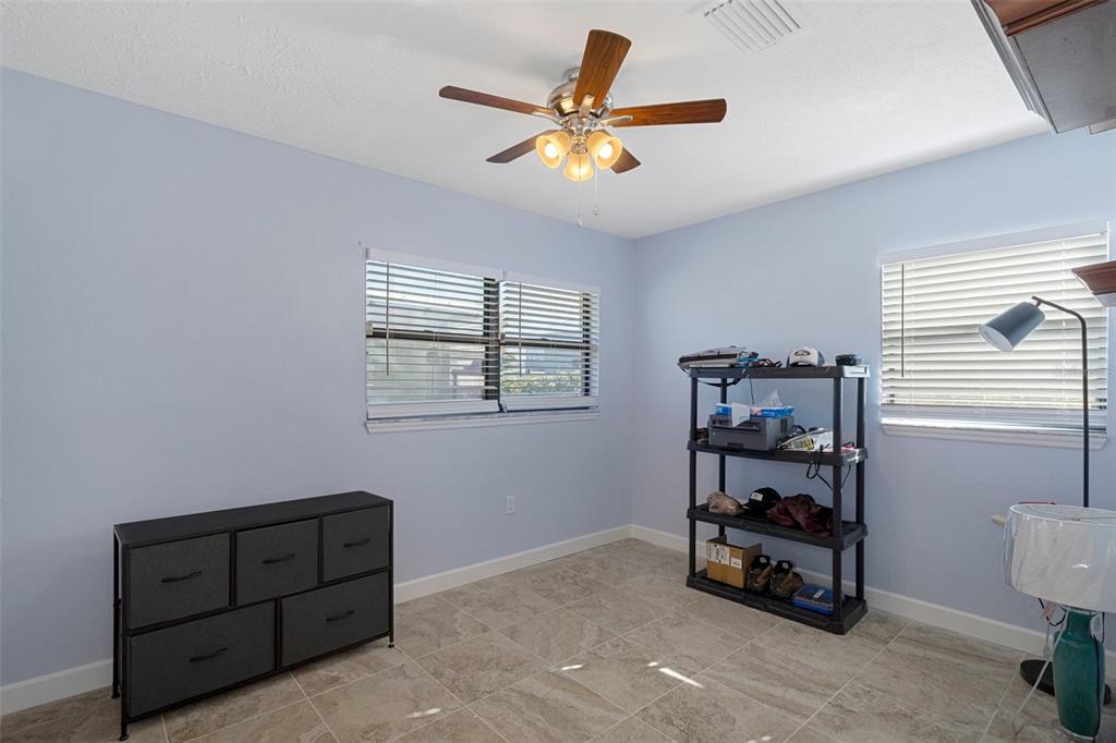 4964 Cedarbrook Lane Hernando Beach, FL 34607 - Photo 17 of 29 a living room with furniture and a window