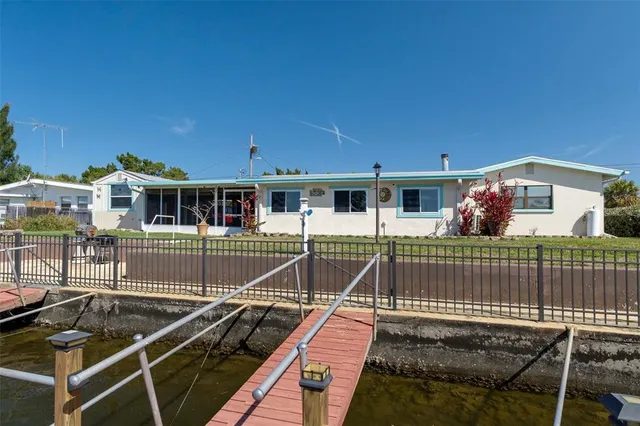 a view of a house with a wooden deck