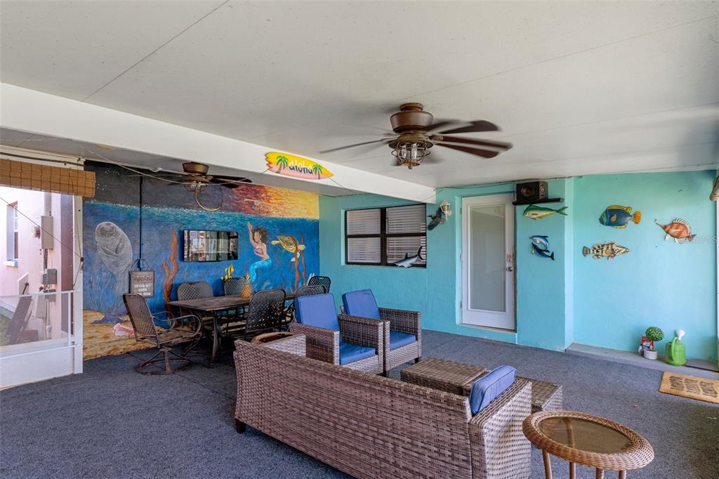 4964 Cedarbrook Lane Hernando Beach, FL 34607 - Photo 23 of 29 a living room with furniture and a rug