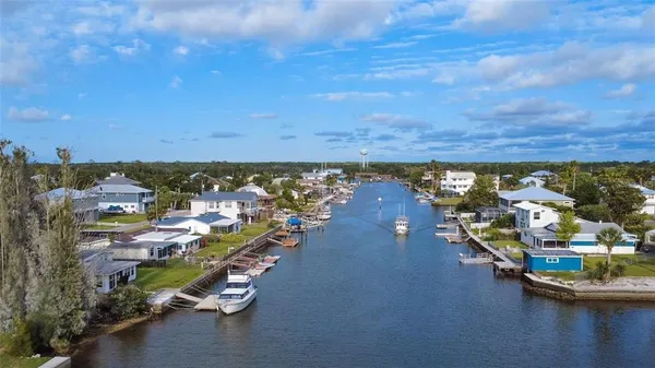 an aerial view of a houses with ocean view