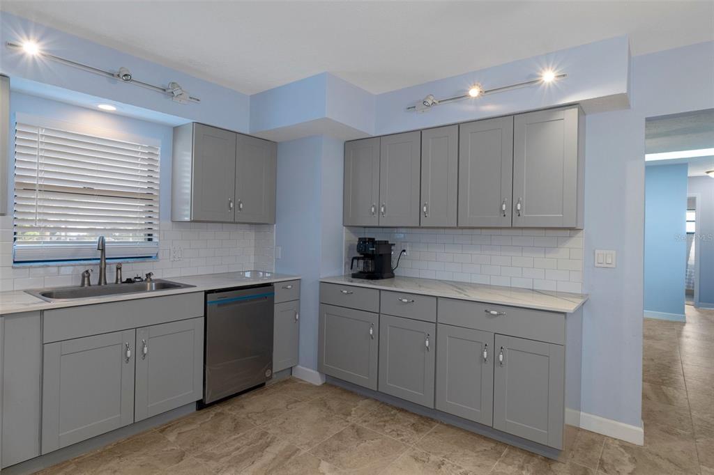 4964 Cedarbrook Lane Hernando Beach, FL 34607 - Photo 8 of 29 a kitchen with sink and cabinets