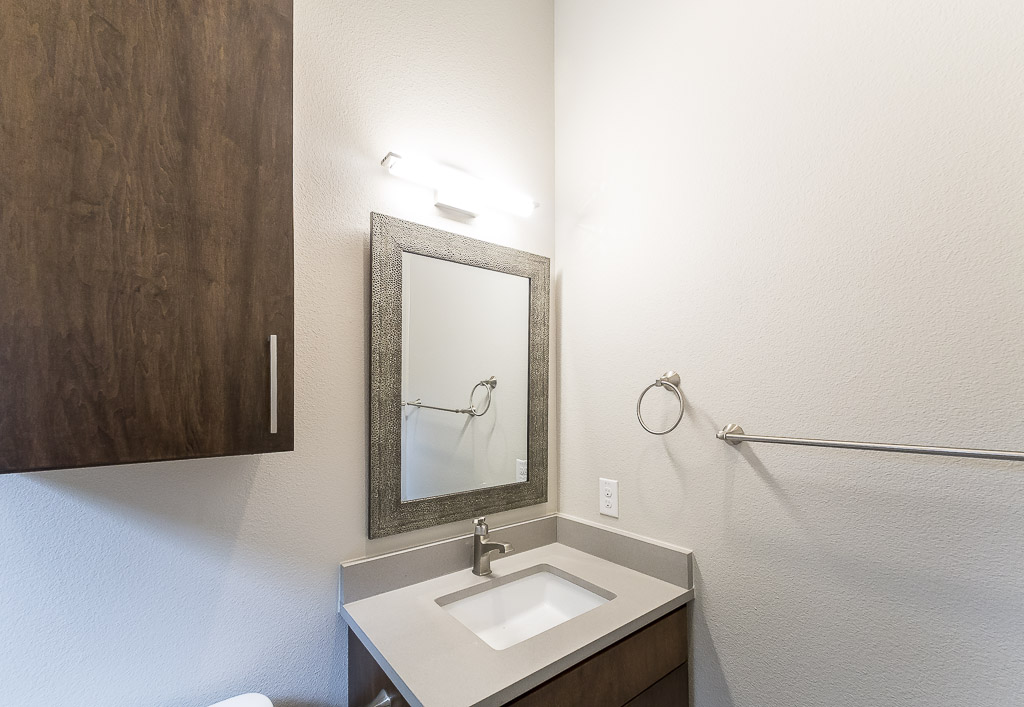 2501 East 9th Street Austin, TX 78702 - Photo 16 of 38 a bathroom with a sink and a mirror