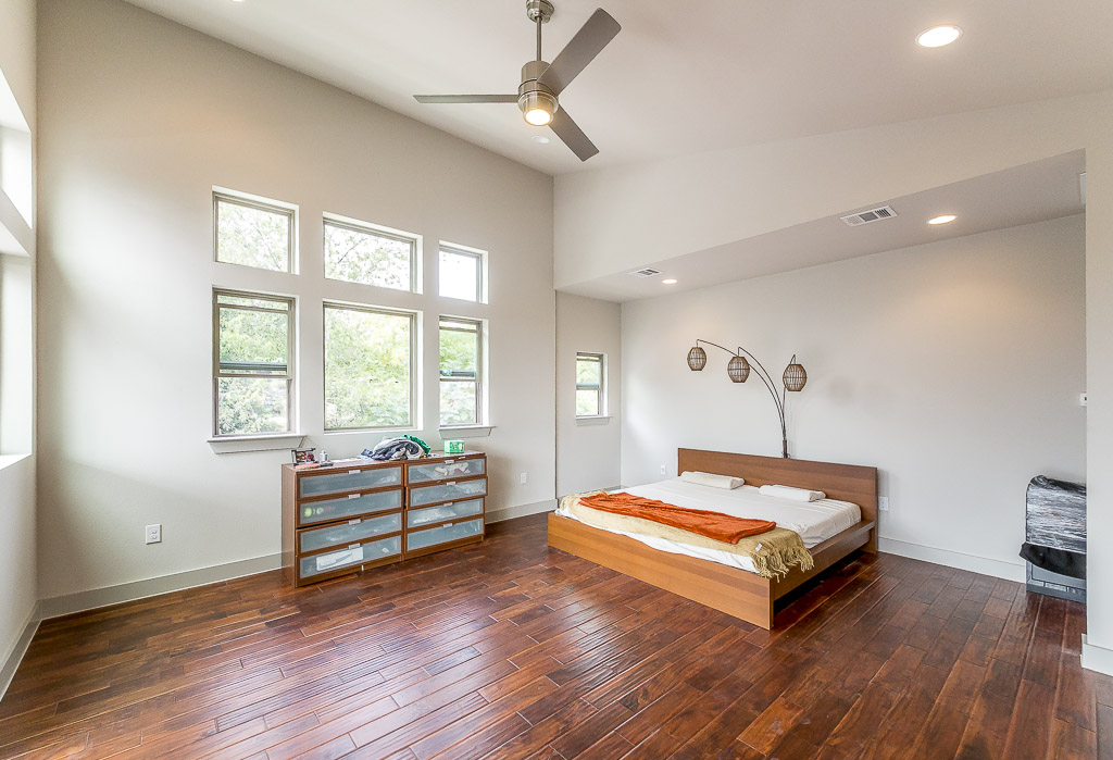 2501 East 9th Street Austin, TX 78702 - Photo 21 of 38 a bedroom with a bed and a large window
