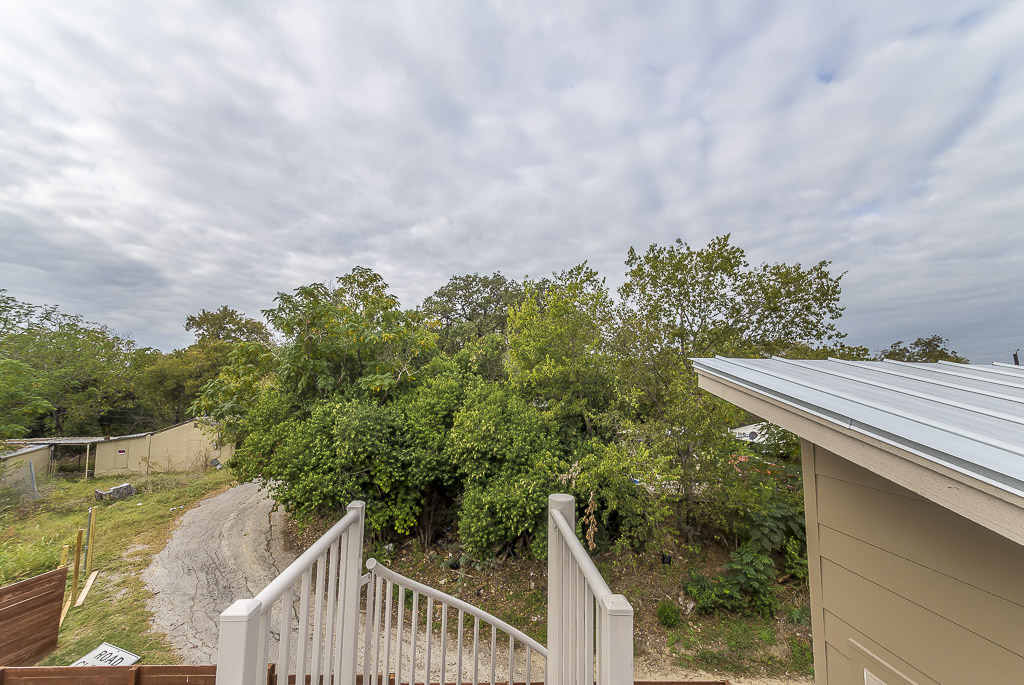 2501 East 9th Street Austin, TX 78702 - Photo 37 of 38 a balcony with trees in front of it