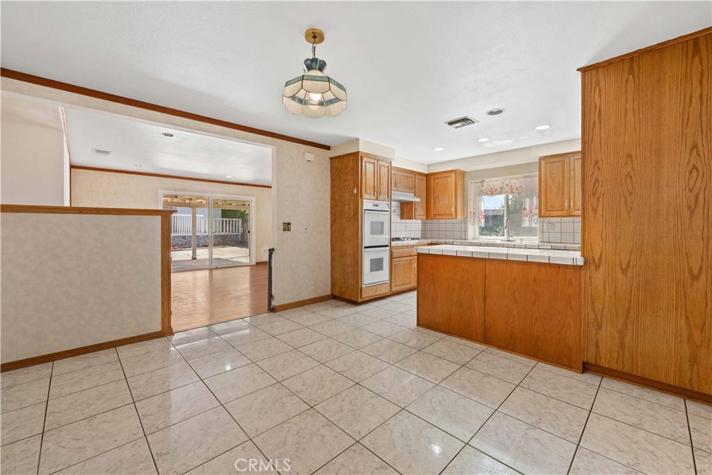 6664 Tapley Street Simi Valley, CA 93063 - Photo 6 of 31 Combo family room & dining area is open to the living room.