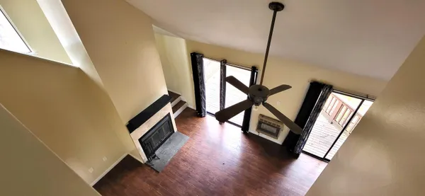a view of an entryway with wooden floor