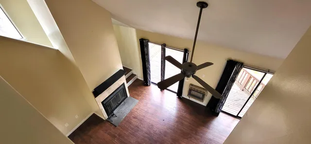 a view of an entryway with wooden floor