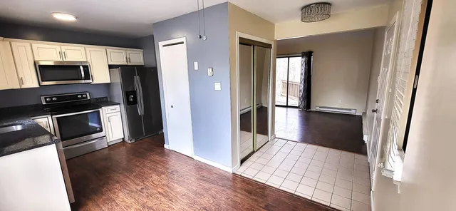 a view of a kitchen from the hallway