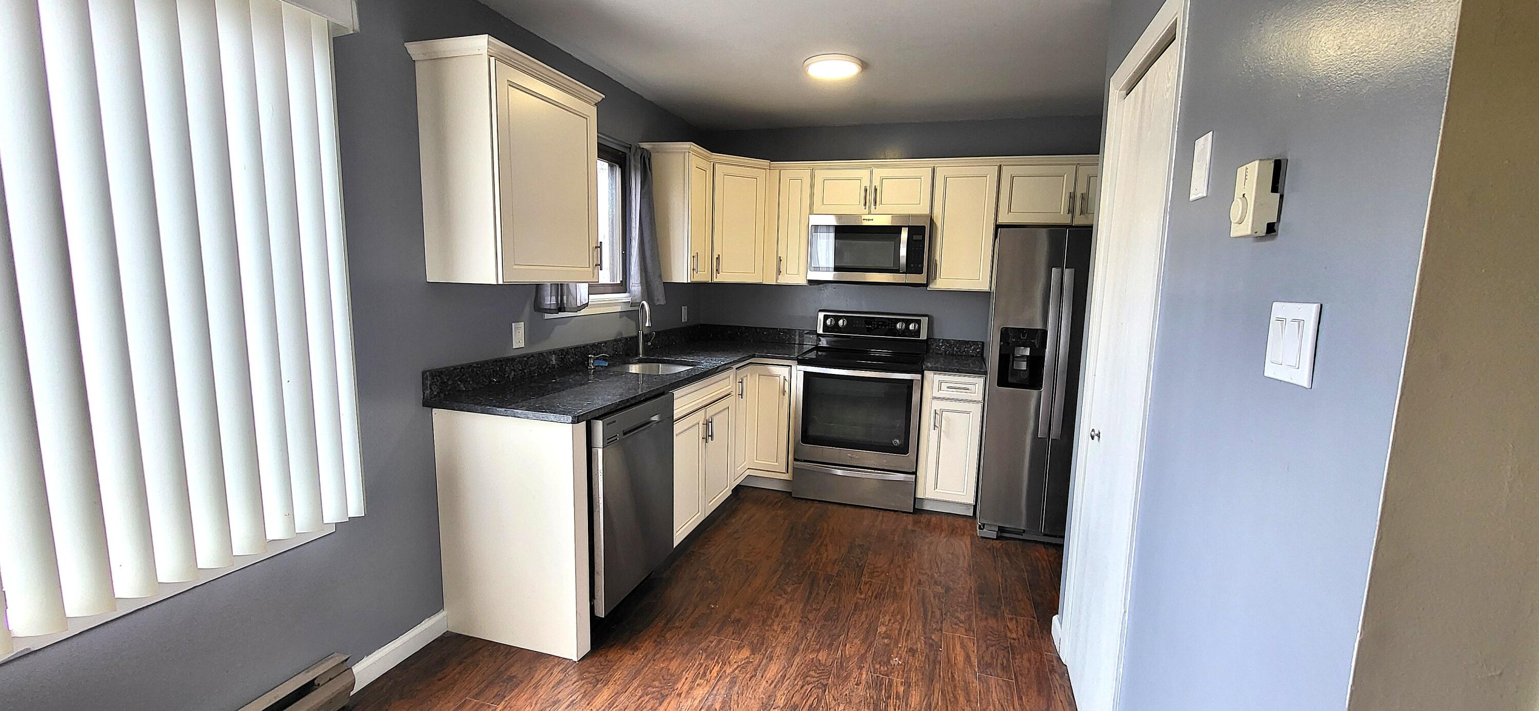 264 Bristol Way Bushkill, PA 18324 - Photo 5 of 24 a kitchen with stainless steel appliances a stove top oven a sink and a refrigerator