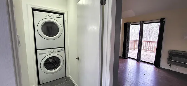 a view of a hallway with washer and dryer