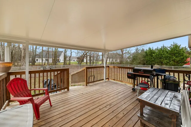 a view of a chairs on deck with wooden floor