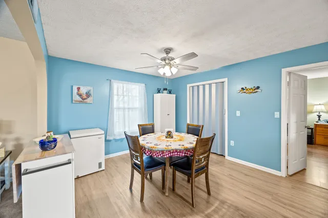 a dining room with furniture and window