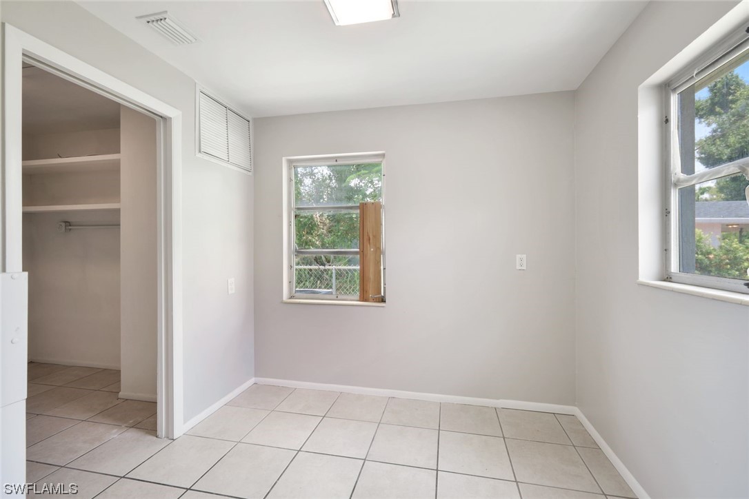 2968 Sunset Road Fort Myers, FL 33901 - Photo 15 of 23 an empty room with windows