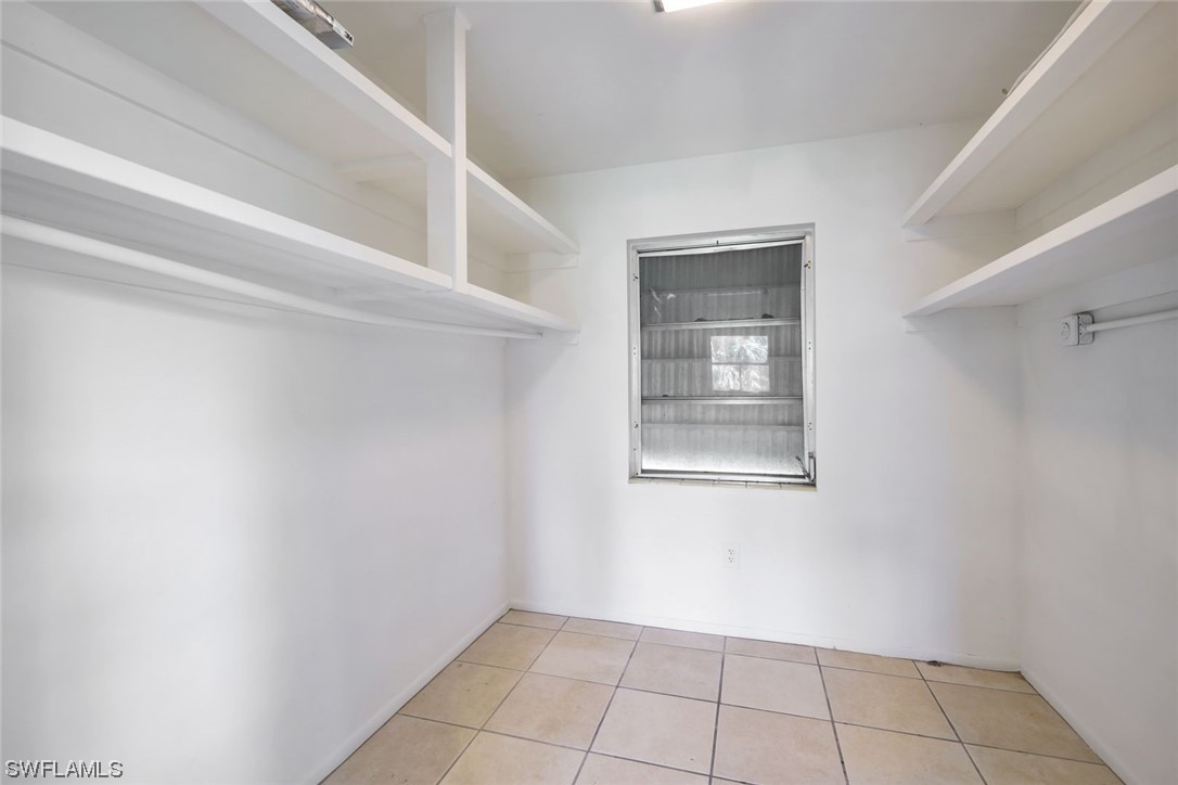 2968 Sunset Road Fort Myers, FL 33901 - Photo 16 of 23 a view of an empty room with windows