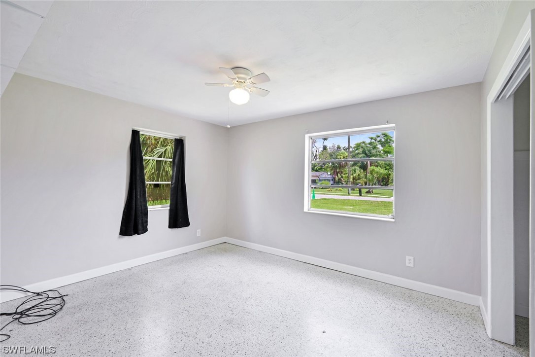 2968 Sunset Road Fort Myers, FL 33901 - Photo 17 of 23 an empty room with windows and closet