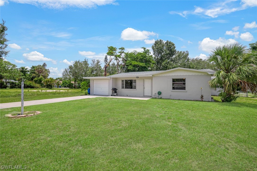 2968 Sunset Road Fort Myers, FL 33901 - Photo 23 of 23 a view of a house with backyard and a garden