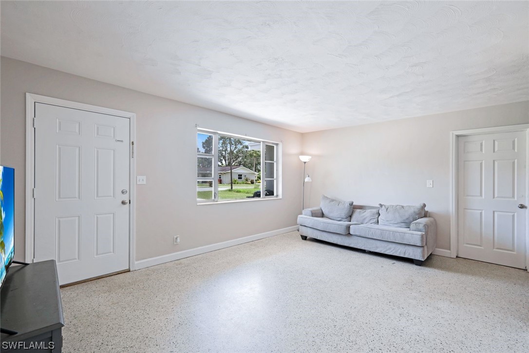 2968 Sunset Road Fort Myers, FL 33901 - Photo 3 of 23 a living room with furniture and a window