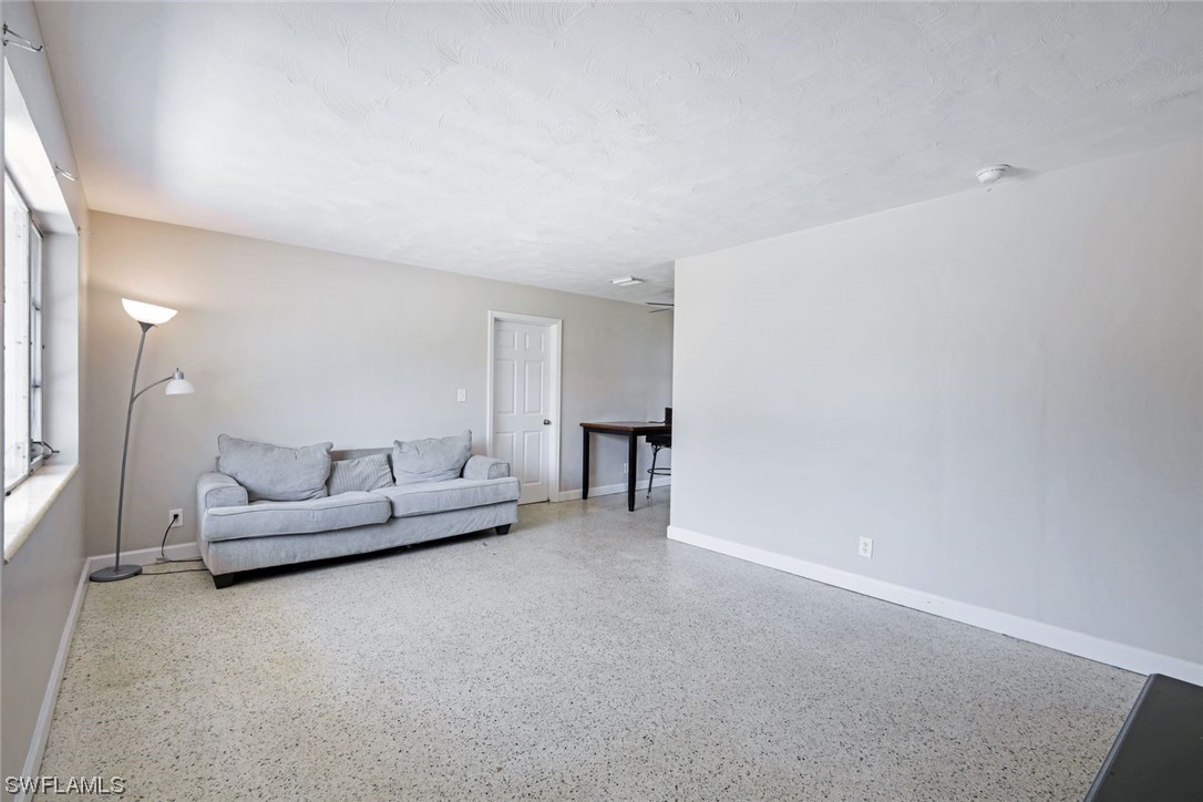 2968 Sunset Road Fort Myers, FL 33901 - Photo 4 of 23 a living room with furniture and a couch