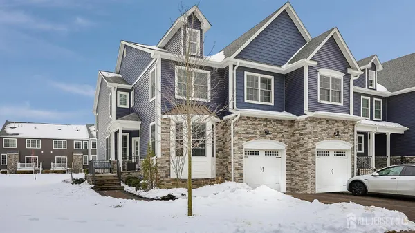 a view of a house with more windows and cars