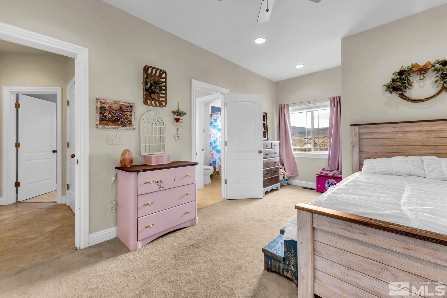 3100 Yellow Tail Road Reno, NV 89510 - Photo 13 of 40 a bed room with a bed and a dresser