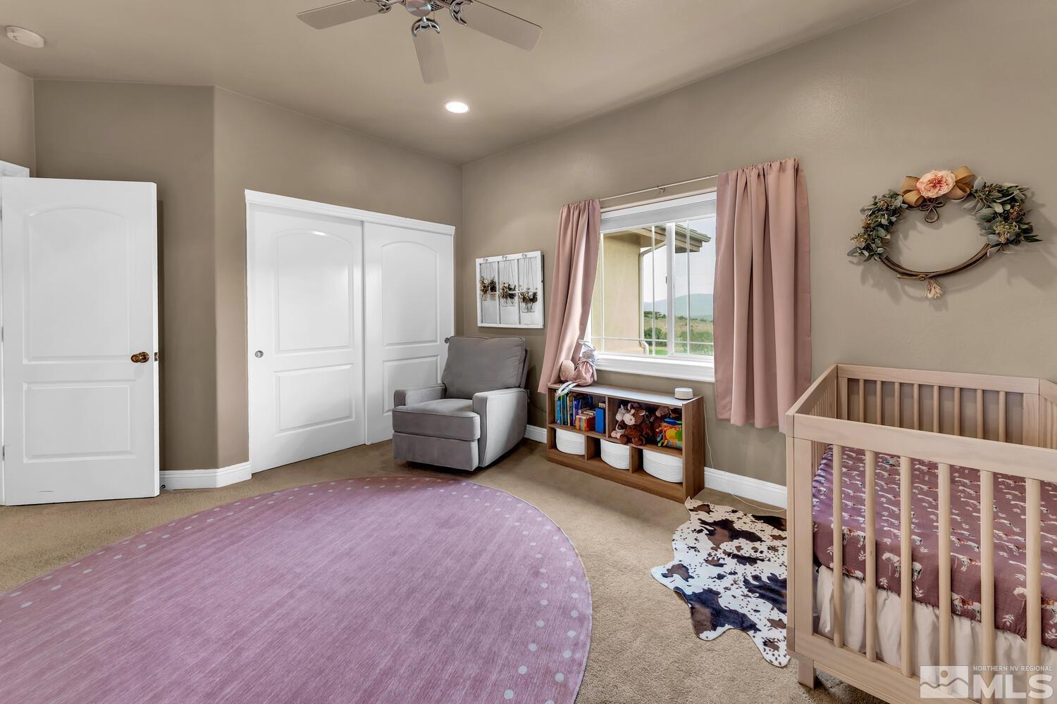 3100 Yellow Tail Road Reno, NV 89510 - Photo 14 of 40 a spacious bedroom with furniture and a window